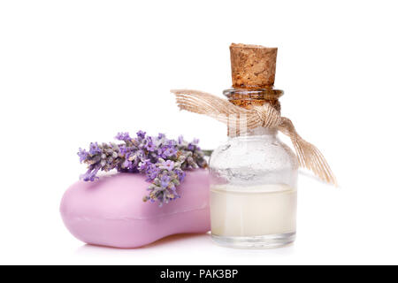 Lavender oil in a glass vial with soap isolated on a white background Stock Photo