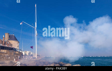 Race officers at the Royal Yacht Squadron in Cowes conduct the start of the 1,204 yachts competing in the 87th annual Round The Island Race. The world Stock Photo