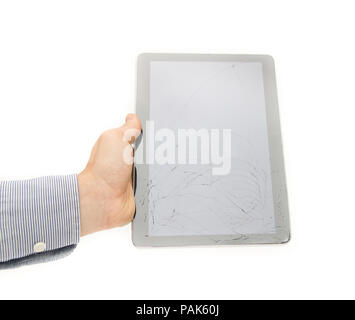 Cracked tablet touch screen display on a white background suggesting the need tu insure and protect your electronic device from dangers like breaking  Stock Photo
