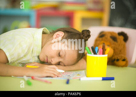 Tired schoolgirl fall asleep  Stock Photo