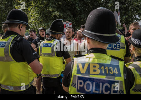 Cambridge, Cambridgeshire, UK. 21st July, 2018. Police move Tommy Robinson supporters during the Free Tommy Robinson protest in Cambridge.Protests calling for the release of Tommy Robinson have become a growing trend across the UK since his imprisonment in May. Public opinion is divided across Britain with regards to Tommy Robinson and the issue of freedom of speech in the UK. Credit: Edward Crawford/SOPA Images/ZUMA Wire/Alamy Live News Stock Photo