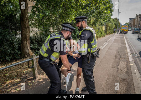 Cambridge, Cambridgeshire, UK. 21st July, 2018. A Tommy Robinson supporter is arrested during the Free Tommy Robinson protest in Cambridge.Protests calling for the release of Tommy Robinson have become a growing trend across the UK since his imprisonment in May. Public opinion is divided across Britain with regards to Tommy Robinson and the issue of freedom of speech in the UK. Credit: Edward Crawford/SOPA Images/ZUMA Wire/Alamy Live News Stock Photo