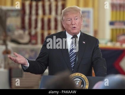 Washington, District of Columbia, USA. 23rd July, 2018. United States President Donald J. Trump makes remarks after touring the White House ''Made in America Showcase'' in the Cross Hall of the White House in Washington, DC on Monday, July 23, 2018.Credit: Ron Sachs/CNP Credit: Ron Sachs/CNP/ZUMA Wire/Alamy Live News Stock Photo