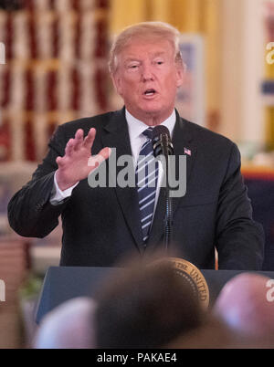Washington, United States Of America. 23rd July, 2018. United States President Donald J. Trump makes remarks after touring the White House 'Made in America Showcase' in the Cross Hall of the White House in Washington, DC on Monday, July 23, 2018. Credit: Ron Sachs/CNP | usage worldwide Credit: dpa/Alamy Live News Stock Photo