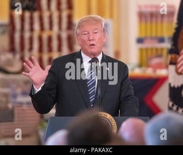 United States President Donald J. Trump makes remarks after touring the White House 'Made in America Showcase' in the Cross Hall of the White House in Washington, DC on Monday, July 23, 2018. Credit: Ron Sachs/CNP /MediaPunch Stock Photo