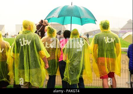 Builth Wells Wales UK, Tuesday 24 July 2018  UK Weather: People sheltering from the rain at the Royal Welsh Show, the UK’s leading agricultural event   photo © Keith Morris / Alamy Live News Stock Photo