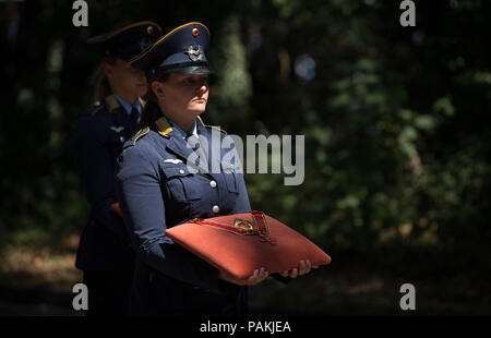 Warendorf, Germany. 24th July, 2018. The Federal Cross of Merit is carried on a pillow at the funeral service for show-jumper Hans Guenter Winkler. Winkler had died in Warendorf on 9 July 2018. Credit: Friso Gentsch/dpa/Alamy Live News Stock Photo