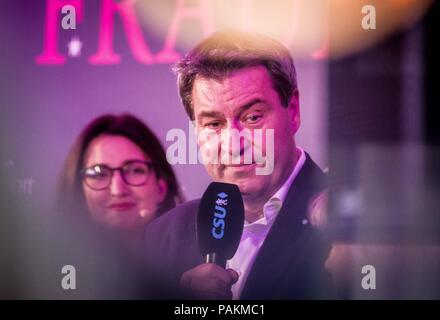 Munich, Bavaria, Germany. 24th July, 2018. The Minister-President of Bavaria MARKUS SODER (MARKUS SÃ-DER) made an appearance at the Lange Nacht der Frauen Union (Long Night of the Womens' Union) at the CSU-Landesleitung. Soder has become a devisive figure in Bavaria and Germany due to the institution of policies including the hanging of crosses in public offices. ying that asylum seekers have vacation-like conditions while on the run and after arriving in Germany. In contrast, Credit: ZUMA Press, Inc./Alamy Live News Stock Photo