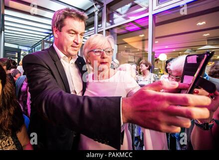 Munich, Bavaria, Germany. 24th July, 2018. The Minister-President of Bavaria MARKUS SODER (MARKUS SÃ-DER) takes selfies with members of the CSU Frauen Union. The Minister-President of Bavaria MARKUS SODER (MARKUS SÃ-DER) made an appearance at the Lange Nacht der Frauen Union (Long Night of the Womens' Union) at the CSU-Landesleitung. Soder has become a devisive figure in Bavaria and Germany due to the institution of policies including the hanging of crosses in public offices. Credit: ZUMA Press, Inc./Alamy Live News Stock Photo