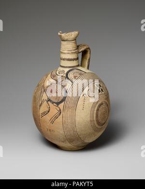 Terracotta jug. Culture: Cypriot. Dimensions: H. 10 3/8 in. (26.4 cm). Date: 750-600 B.C..  Vertical-circle ornament and highly conventionalized bird. Museum: Metropolitan Museum of Art, New York, USA. Stock Photo