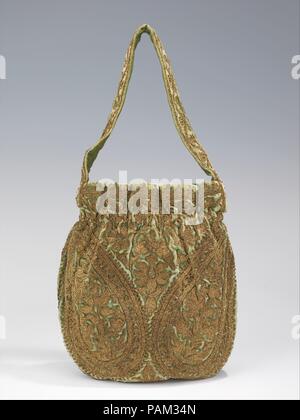 Evening bag. Culture: French. Design House: House of Lanvin (French, founded 1889). Designer: Jeanne Lanvin (French, 1867-1946). Date: 1925-35.  Jeanne Lanvin was apprenticed to a milliner and a dressmaker before opening her own millinery shop in 1889.  She expanded into dressmaking when her clients began asking for the ensembles in which she adorned her daughter, Marguerite di Pietro (1897-1958).  Her style embodied the femininity of youth in a most modern way with meticulous and relatively sparse surface embellishments and robe de style silhouettes, which could be worn by women of all ages.  Stock Photo