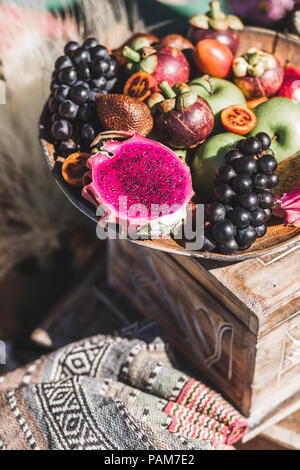 Fruit plate with apple, passion fruit, grape, mangosteen, dragonfruit on wooden plate Stock Photo