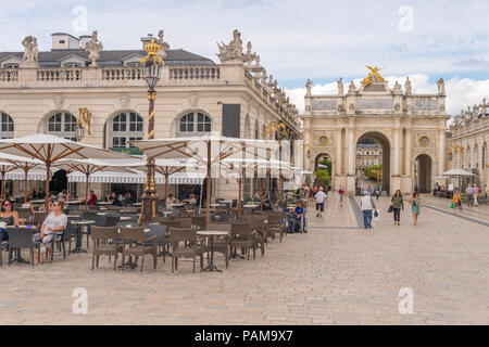 Nancy, France - 21 June 2018: Arc de Triomphe Héré and Café Terrace in the Place Stanislas Square. Stock Photo