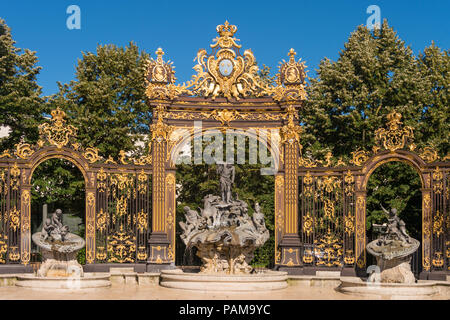 Golden gate to the Place Stanislas square and Neptune Fountain in Nancy, France. Stock Photo