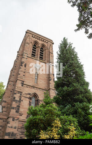 Tower of St Matthew's Church in Stretton, Cheshire, where the clock face shows the words 'TIME IS NOT ALL' Stock Photo