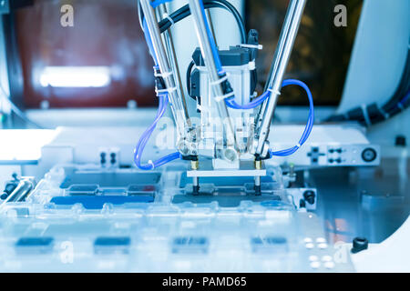 obotic pneumatic piston sucker unit on industrial machine,automation compressed air factory production Stock Photo