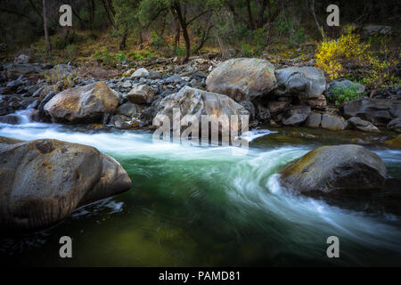 Beautiful green pool with swirling rapids - Tuolumne River in Groveland, California Stock Photo