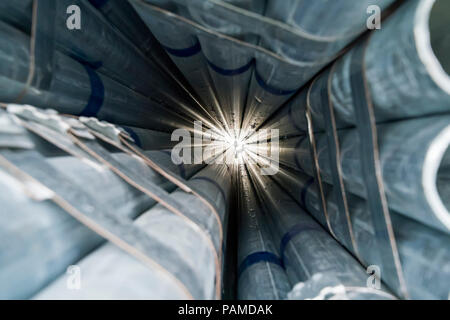 Steel Pipes Industry Construction stacked in Factory warehouse Stock Photo