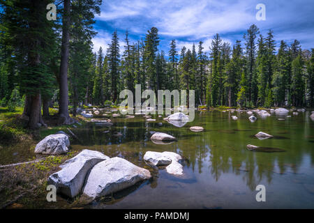 Large boulders strewn about an alpine pool near May Lake, in the Sierra Alpine Mountains - Yosemite National Park Stock Photo