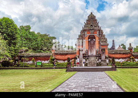 Bali, Indonesia - Jan 2, 2018: Tourists visiting Pura Taman Ayun temple, in village of Mengwi Badung on Bali, Indonesia.  It is a place to worship roy Stock Photo