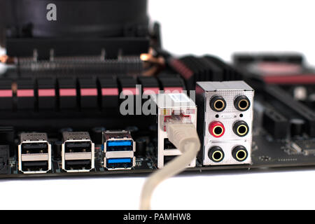 A motherboard with a network cable connected to it Stock Photo