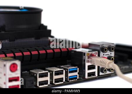 A motherboard with a network cable connected to it Stock Photo