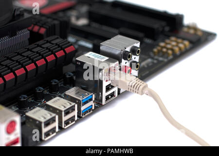 A motherboard with a network cable connected to it Stock Photo