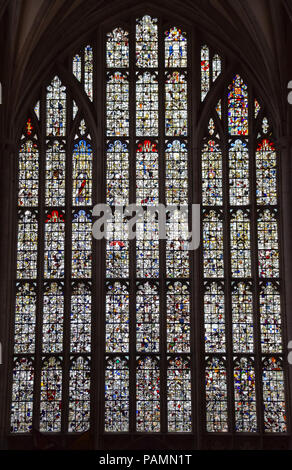 Winchester, United Kingdom - April 29 2018:   The stained glass west window of Winchester Cathedral, which was smashed by Oliver Cromwells forces duri Stock Photo