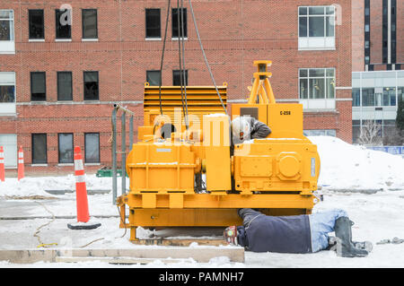 Setting up a tower crane in the winter in Rochester, NY. Stock Photo