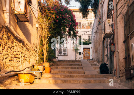 a stone alleyway with stairs at sunset in Old Jaffa, Tel Aviv-Yafo, Israel Stock Photo