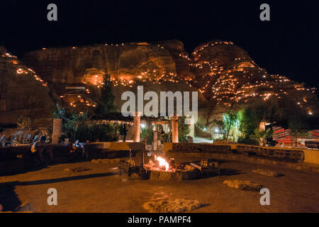 the view at night over the common area of a tourist Bedouin camp in Wadi Musa, near Petra, Jordan Stock Photo