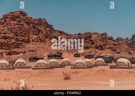 dome-like hotel rooms in the style of Ridley Scott's The Martian film clustered together at SunCity camp in Wadi Rum National Park, Jordan Stock Photo