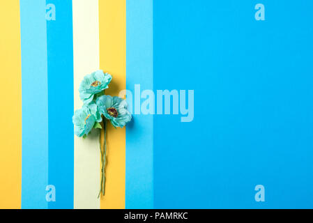 Beautiful and fashionable background for business and study from paper of different colors and summer flowers Stock Photo