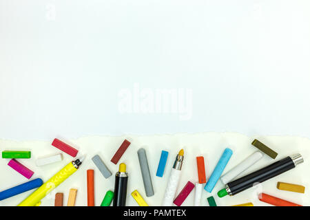 markers and colored crayons on paper sheet. painting tools on white background with copy space Stock Photo