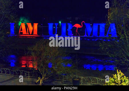 Urmia, Iran - April 8, 2018: Installation on the street in the form of text in English: I am Urumia near river at night Stock Photo