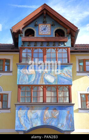 VAL GARDENA, ITALY - JUNE 29, 2018: A colorful house facade (Sarteur House) with paintings and a musical clock on the top in Selva Stock Photo
