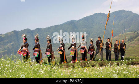 A Chinese villager of Miao ethnic group wearing traditional costumes  practises ''Miao stickfighting'', a unique martial art of the Miao Martial  Arts i Stock Photo - Alamy