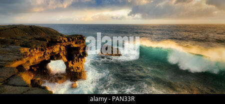Unnamed sea arch and waves in the Puna district, Hawaii. Stock Photo