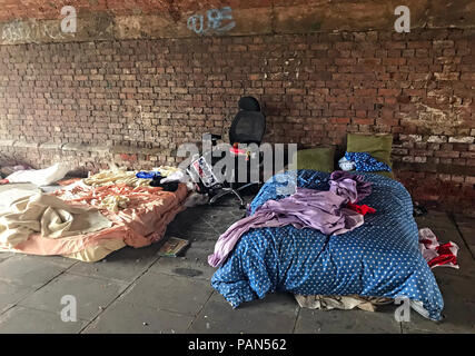 Homeless Rough Sleepers Bed under railway viaduct, Castlefield,Manchester, North West England, UK Stock Photo
