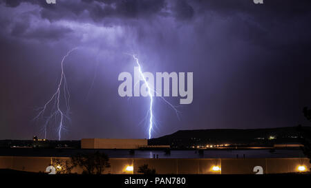 Lightning bolts streaking down from storm clouds over Lakewood, Colorado USA Stock Photo