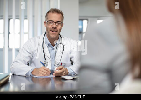 Doctor and patient in medical practice Stock Photo