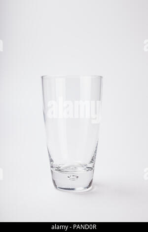 Tall empty glass isolated on white Stock Photo