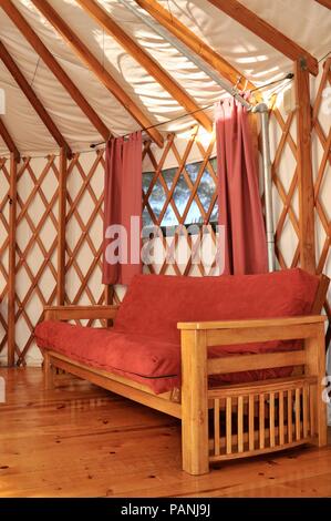 Fabric and wood framed yurt structures for, luxurious, upscale 'glamping' (glamorous camping) at Treebones Resort, Big Sur, California, USA. Stock Photo
