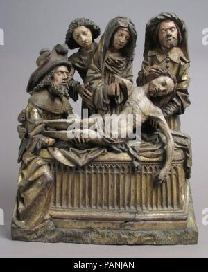The Entombment of Christ with the Virgin Mary, Saint John, Nicodemus, and Joseph of Arimathea. Culture: German or South Netherlandish. Dimensions: Overall: 19 1/2 x 15 5/16 x 3 3/4in. (49.5 x 38.9 x 9.5cm). Date: 1500-1510.  In this Lamentation and Entombment scene, the frail attenuated body of Christ is laid into the tomb by Nicodemus and Joseph of Arimathea, as the Virgin Mary, supported by Saint John, looks on. Christ's body is tilted toward the viewers so that they, too, may share in the sorrow of the moment. Museum: Metropolitan Museum of Art, New York, USA. Stock Photo