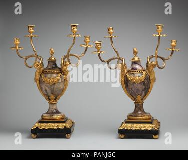 Pair of candelabra perfume burners. Culture: British, Soho near Birmingham. Dimensions: Overall (.1631, wt. confirmed): 23 3/4 × 18 1/4 × 8 3/4 in., 26 lb. (60.3 × 46.4 × 22.2 cm, 11.8 kg);  Overall (.1632, wt. confirmed): 23 3/4 × 19 × 8 1/2 in., 26 lb. (60.3 × 48.3 × 21.6 cm, 11.8 kg). Maker: Matthew Boulton (British, Birmingham 1728-1809 Birmingham); and James Fothergill (died 1782). Date: ca. 1770.  A candelabrum of this design sold in 1771 was described in the sale catalogue as 'a large vase of radix amethysti and or moulu lined with silver and perforated for insence with four branches fo Stock Photo