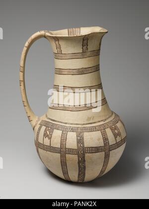 Terracotta jug. Culture: Cypriot. Dimensions: H. 9 3/8 in. (23.8 cm). Date: ca. 1600-1150 B.C..  White slip ware with handle, pinched lip, lattice, lozenge and wavy lines. Museum: Metropolitan Museum of Art, New York, USA. Stock Photo