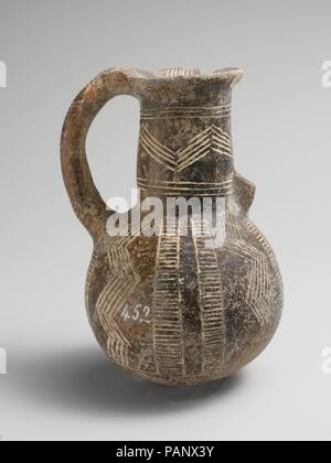 Terracotta jug. Culture: Cypriot. Dimensions: H. 4 3/16 in. (10.6 cm). Date: ca. 2500-1900 B.C..  One-handled with incised bands and incised zigzags. Museum: Metropolitan Museum of Art, New York, USA. Stock Photo