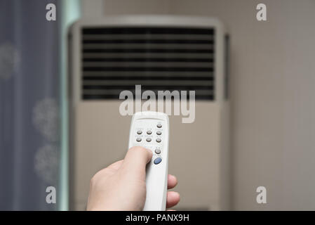 Air condition control by using remote control Stock Photo