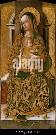 Madonna and Child Enthroned. Artist: Carlo Crivelli (Italian, Venice (?), active by 1457-died 1495 Ascoli Piceno). Dimensions: 38 3/4 x 17 1/4 in. (98.4 x 43.8 cm). Date: 1472.  These three panels are from an altarpiece painted for a Dominican church in the Marchigian town of Ascoli Piceno. It is possible that the child was originally shown reaching for a flying bird, his frequent attribute. The cracked marble dais is a recurrent feature of Crivelli's work. On it are two pears, symbolic of the Fall of Man, and a fly, conceivably an emblem of Satan. Crivelli loved visual tricks, and the shadow  Stock Photo