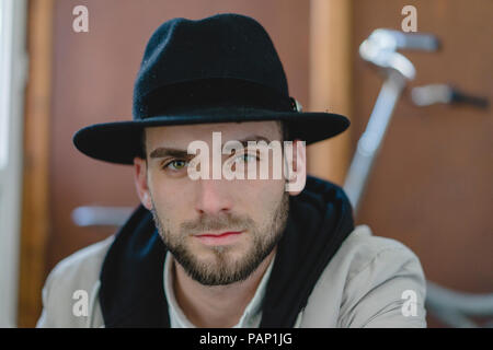 Bearded man wearing black hat Stock Photo